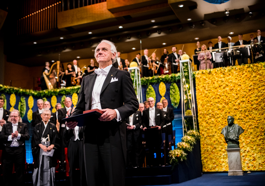 U-M professor Gerard Mourou at the Nobel Prize ceremony, receiving his award
