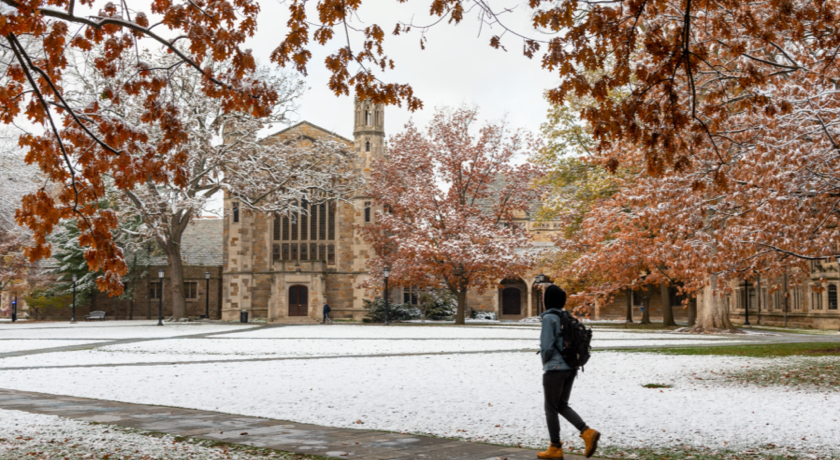 A student crosses U-M's famous Law Quad on a winter day.