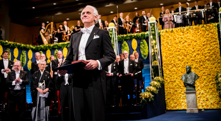 U-M professor Gerard Mourou at the Nobel Prize ceremony, receiving his award